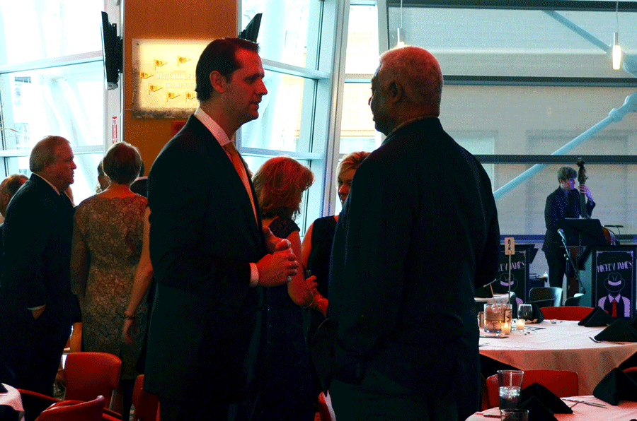 NKU men's basketball coach John Brannen (left) and University of Cincinnati basketball legend Oscar Robertson (right) chat during the "Night with the Norse" gala Oct. 8 at Great American Ball Park.