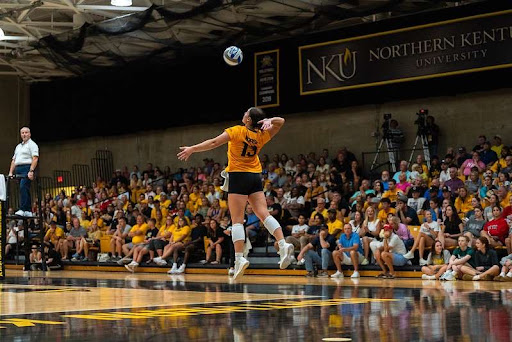 Anna Burke in action serving at Friday night's game. 