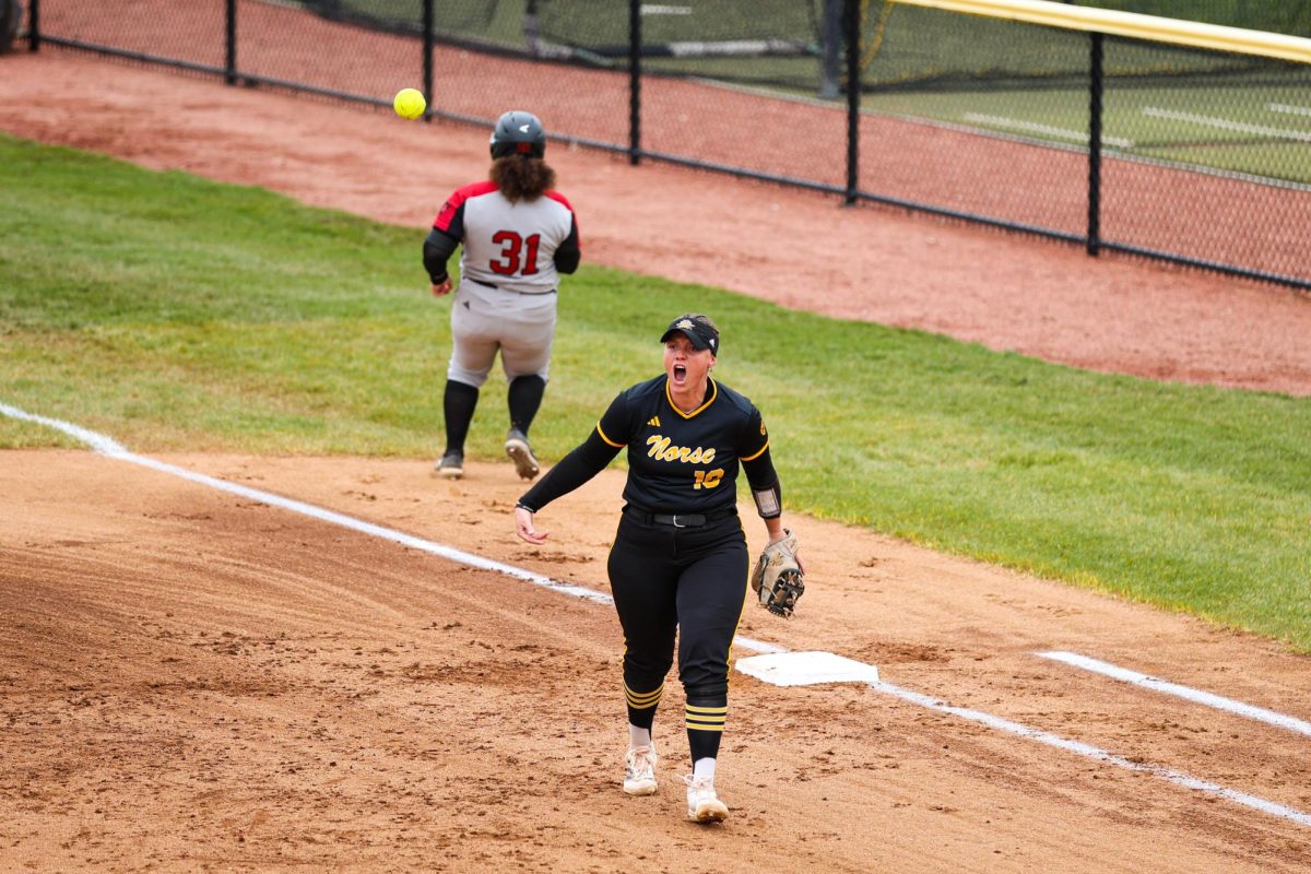 Senior Trinity Robertson (19) getting the team fired up after an inning-ending ground out.